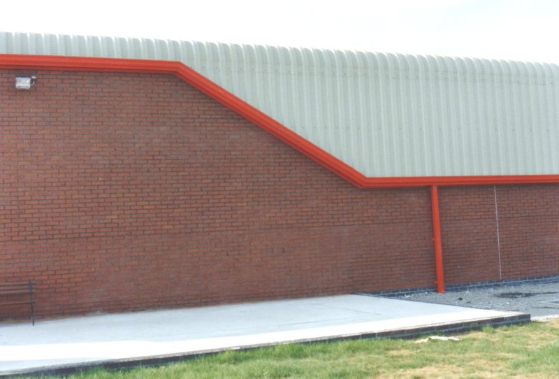 Curved_Eave_and_Red_Sheeting_Steel_Building_Industrial_Factory_Custom_Precision_UK_02