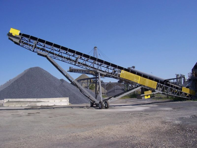 Screen Station Buildings and Screen Feed&Discharge Conveyors Steel Structures: 36” x 120’ Radial Stacker; wrap drive with lever-arm gravity take-up